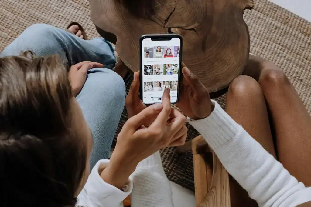 Two people scrolling on social media