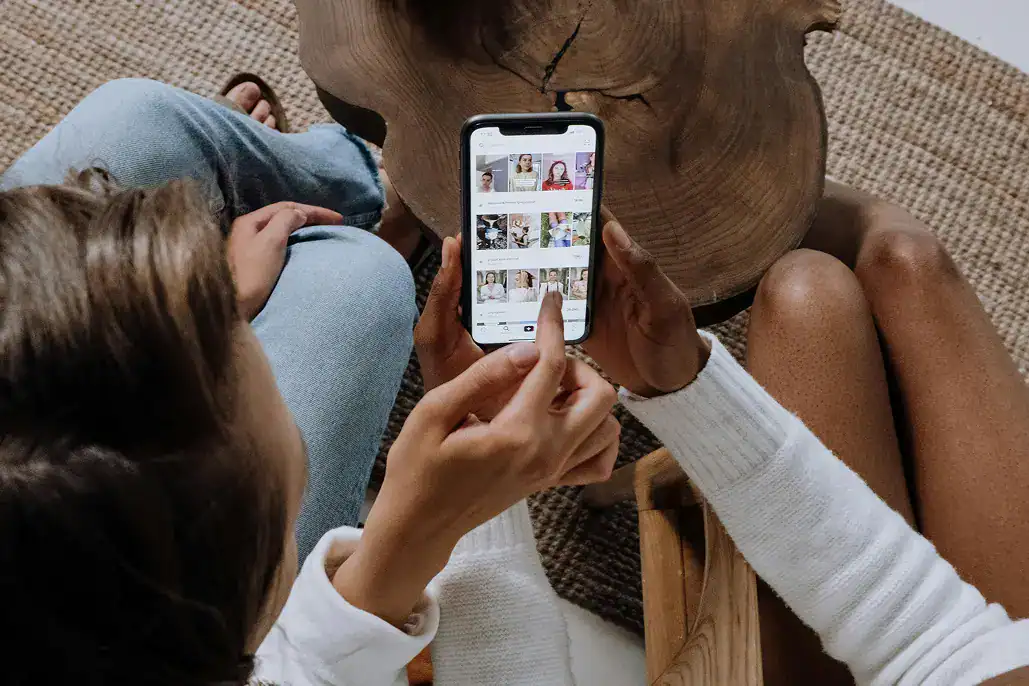 Two people scrolling on social media