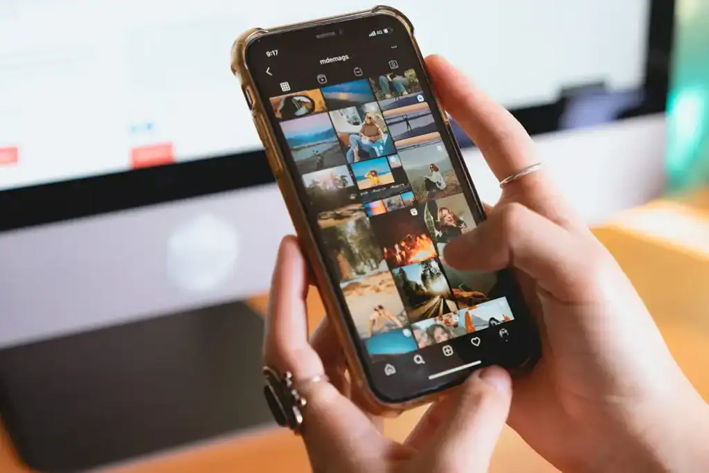 Female hands holding a phone scrolling on social media
